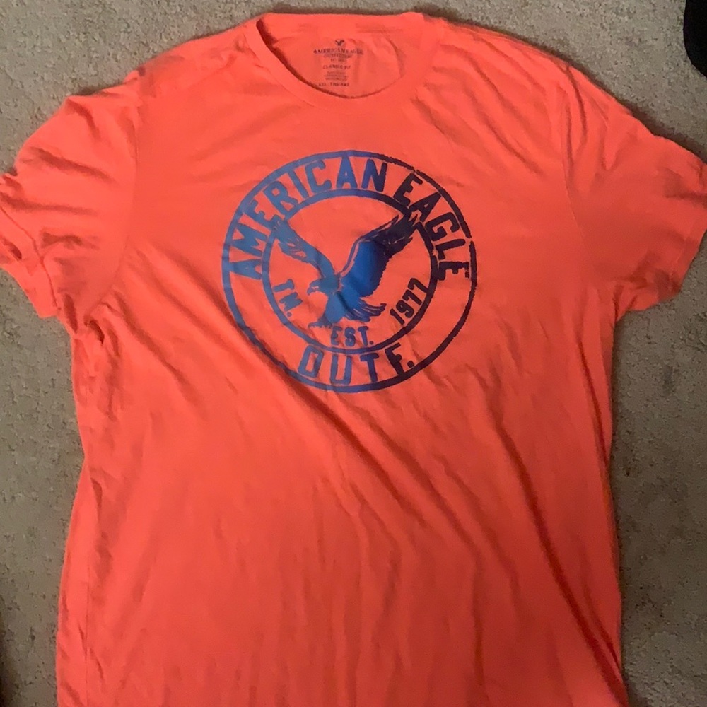 American Eagle Salmon Colored Shirt with Blue logo, size is XXL, classic fit